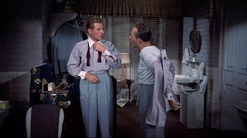 Movie still from “White Christmas” (1954), directed by Michael Curtiz – Two men are talking in a dressing room; Medium shot, Low angle