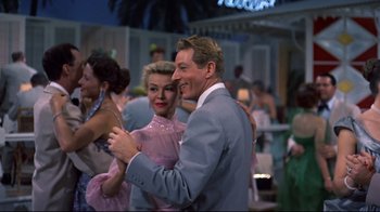 Movie still from “White Christmas” (1954), directed by Michael Curtiz – A man and a woman are dancing together; Medium shot, Low angle