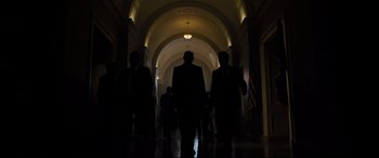 Movie still from “White House Down” (2013), directed by Roland Emmerich – A group of people walking down a hall way; Wide shot, Low angle