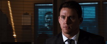Movie still from “White House Down” (2013), directed by Roland Emmerich – A person wearing a suit and tie; Close Up shot, Over the shoulder angle