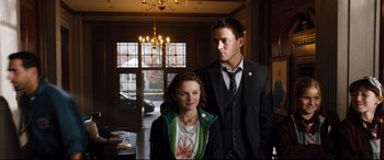 Movie still from “White House Down” (2013), directed by Roland Emmerich – A man and a woman standing next to each other in a room; Medium shot, Over the shoulder angle