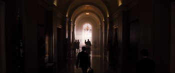 Movie still from “White House Down” (2013), directed by Roland Emmerich – A group of people walking down a hall way; Extreme Wide shot, Low angle