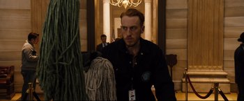 Movie still from “White House Down” (2013), directed by Roland Emmerich – A man standing next to a woman in a room; Medium shot, Low angle