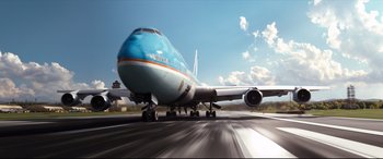 Movie still from “White House Down” (2013), directed by Roland Emmerich – A large jetliner sitting on top of an airport runway; Extreme Wide shot, Low angle