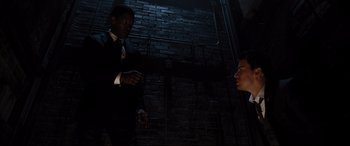 Movie still from “White House Down” (2013), directed by Roland Emmerich – A man in a suit and tie talking to another man in a suit and tie; Medium shot, Low angle