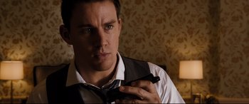 Movie still from “White House Down” (2013), directed by Roland Emmerich – A person wearing a tie; Close Up shot, Over the shoulder angle
