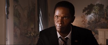 Movie still from “White House Down” (2013), directed by Roland Emmerich – A person wearing a suit and tie; Close Up shot, High angle