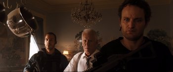 Movie still from “White House Down” (2013), directed by Roland Emmerich – A man in a white dress shirt and a tie; Medium shot, Low angle