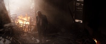 Movie still from “White House Down” (2013), directed by Roland Emmerich – An old man in a suit standing in the middle of a room; Wide shot, Low angle