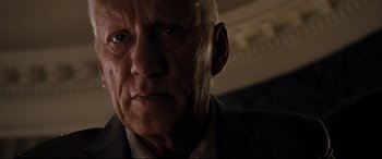 Movie still from “White House Down” (2013), directed by Roland Emmerich – An old man with a serious look on his face; Close Up shot, Low angle