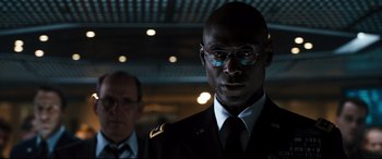 Movie still from “White House Down” (2013), directed by Roland Emmerich – A man in a military uniform standing next to another man; Close Up shot, Low angle