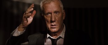 Movie still from “White House Down” (2013), directed by Roland Emmerich – An older man wearing a suit and tie; Close Up shot, Low angle