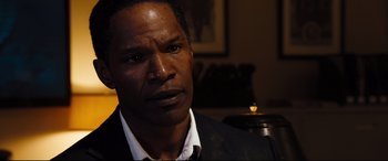 Movie still from “White House Down” (2013), directed by Roland Emmerich – A person wearing a suit and tie; Close Up shot, Over the shoulder angle