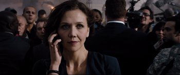 Movie still from “White House Down” (2013), directed by Roland Emmerich – A person talking on a cell phone; Close Up shot, Over the shoulder angle