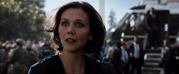 Movie still from “White House Down” (2013), directed by Roland Emmerich – A person looking at the camera; Close Up shot, Over the shoulder angle