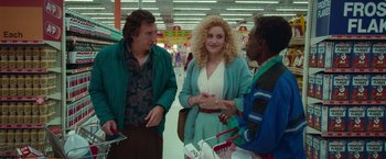 Movie still from “White Noise” (2022), directed by Noah Baumbach – A group of people standing around in a store; Medium shot, Over the shoulder angle