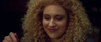 Movie still from “White Noise” (2022), directed by Noah Baumbach – A person with long curly hair; Close Up shot, Low angle