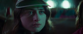 Movie still from “White Noise” (2022), directed by Noah Baumbach – A person wearing a hat; Close Up shot, Over the shoulder angle