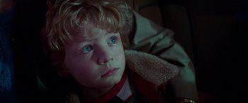 Movie still from “White Noise” (2022), directed by Noah Baumbach – A child with blue eyes; Close Up shot, High angle