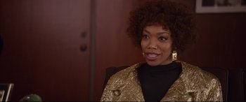 Movie still from “Whitney Houston: I Wanna Dance with Somebody” (2022), directed by Kasi Lemmons – A person wearing a jacket; Close Up shot, Over the shoulder angle