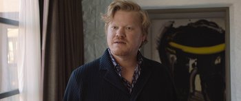 Movie still from “Windfall” (2022), directed by Charlie McDowell – A person wearing a jacket; Close Up shot, Over the shoulder angle