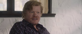 Movie still from “Windfall” (2022), directed by Charlie McDowell – A person wearing a shirt; Close Up shot, Over the shoulder angle