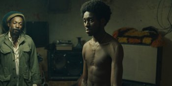 Movie still from “Small Axe” (2020), directed by Steve McQueen – Medium shot, Low angle