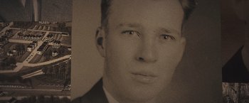 Movie still from “Wormwood” (2017), directed by Errol Morris – An old photo of a young man with a suit on; Extreme Close Up shot, Low angle