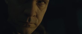 Movie still from “Wormwood” (2017), directed by Errol Morris – A man's face in the dark; Extreme Close Up shot, Low angle