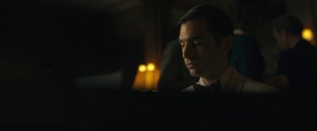 Movie still from “Wormwood” (2017), directed by Errol Morris – A man sitting in front of a computer monitor; Close Up shot, Low angle