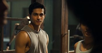 Movie still from “Yeh Ballet” (2020), directed by Sooni Taraporevala – A young man is posing for a picture; Close Up shot, Over the shoulder angle