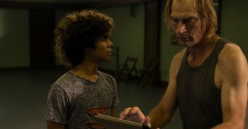 Movie still from “Yeh Ballet” (2020), directed by Sooni Taraporevala – A man and a young boy looking at something on a tablet; Close Up shot, Over the shoulder angle