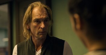 Movie still from “Yeh Ballet” (2020), directed by Sooni Taraporevala – A man with long blonde hair looking at himself in the mirror; Close Up shot, Over the shoulder angle