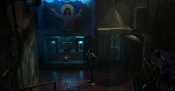 Movie still from “Yeh Ballet” (2020), directed by Sooni Taraporevala – A person standing in a room with a painting on the wall behind them; Extreme Wide shot, High angle