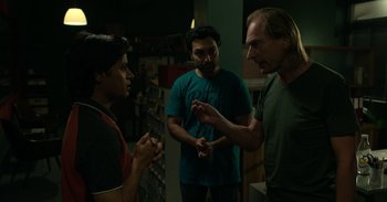 Movie still from “Yeh Ballet” (2020), directed by Sooni Taraporevala – A group of men standing next to each other in a room; Medium shot, Over the shoulder angle