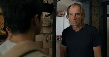 Movie still from “Yeh Ballet” (2020), directed by Sooni Taraporevala – A man standing in front of a mirror in a room; Close Up shot, Over the shoulder angle