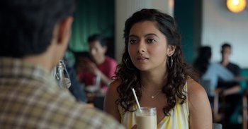 Movie still from “Yeh Ballet” (2020), directed by Sooni Taraporevala – A young woman holding a glass of milk in her right hand; Close Up shot, Over the shoulder angle