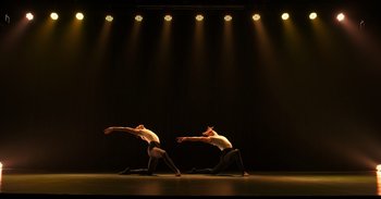Movie still from “Yeh Ballet” (2020), directed by Sooni Taraporevala – A couple of people that are on a stage; Extreme Wide shot, Low angle
