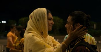 Movie still from “Yeh Ballet” (2020), directed by Sooni Taraporevala – A woman in a yellow dress and a man in a yellow shirt; Close Up shot, Over the shoulder angle