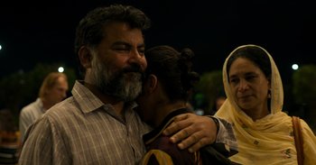 Movie still from “Yeh Ballet” (2020), directed by Sooni Taraporevala – A couple of people that are hugging in the dark; Close Up shot, Over the shoulder angle