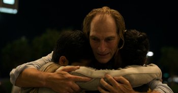 Movie still from “Yeh Ballet” (2020), directed by Sooni Taraporevala – A man hugging another man while he is holding a pillow; Close Up shot, Over the shoulder angle