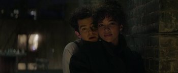 Movie still from “tick, tick... BOOM!” (2021), directed by Lin-Manuel Miranda – A man and a woman are posing for a picture; Close Up shot, Low angle