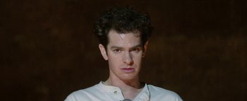 Movie still from “tick, tick... BOOM!” (2021), directed by Lin-Manuel Miranda – A person wearing a white shirt; Close Up shot, Low angle