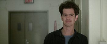 Movie still from “tick, tick... BOOM!” (2021), directed by Lin-Manuel Miranda – A person wearing a black jacket; Close Up shot, Over the shoulder angle