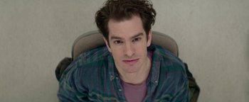 Movie still from “tick, tick... BOOM!” (2021), directed by Lin-Manuel Miranda – A person sitting in a chair; Close Up shot, High angle