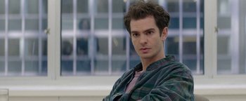 Movie still from “tick, tick... BOOM!” (2021), directed by Lin-Manuel Miranda – A person wearing a plaid shirt; Close Up shot, Over the shoulder angle