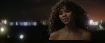 Movie still from “tick, tick... BOOM!” (2021), directed by Lin-Manuel Miranda – A person with curly brown hair; Close Up shot, Over the shoulder angle