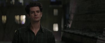 Movie still from “tick, tick... BOOM!” (2021), directed by Lin-Manuel Miranda – A man in a green shirt is looking at the camera; Close Up shot, Low angle