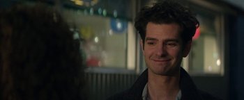 Movie still from “tick, tick... BOOM!” (2021), directed by Lin-Manuel Miranda – A person smiling; Close Up shot, Over the shoulder angle