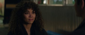 Movie still from “tick, tick... BOOM!” (2021), directed by Lin-Manuel Miranda – A person with curly hair; Close Up shot, Over the shoulder angle